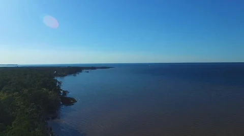 2.7K Drone Lowering Next To Forest on The Bay Video stock 109299567
