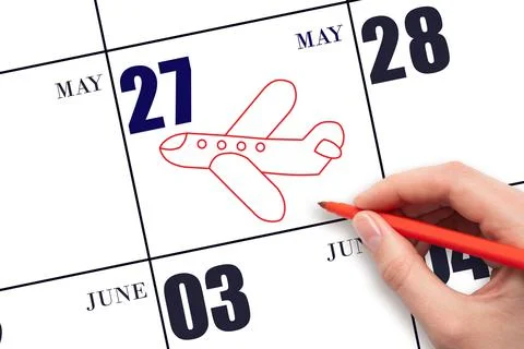 27th day of May. A hand drawing outline of airplane on calendar date 27 May.  Stock Photos