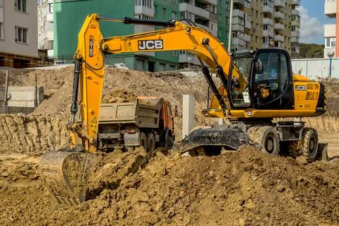 29 august 2019, Kiev, Ukraine:Working Excavator Tractor Digging A Trench At C Stock Photos