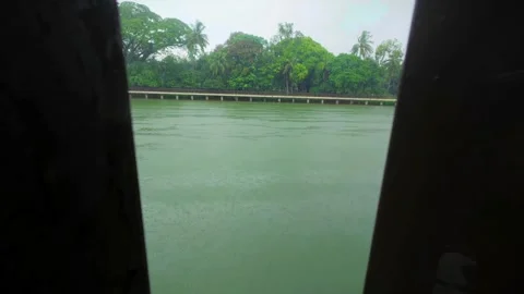 29 Vertical Static Shot of Rainfall Through Bridge Railing Facing Lake Stock Footage 313649948