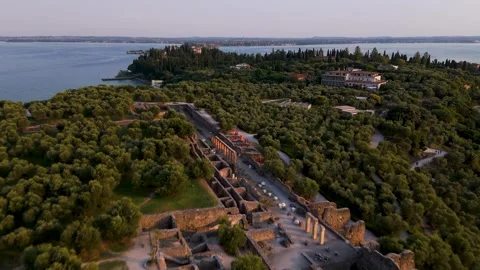 Pan back over Peninsula at Sunset, Sirmione, Lake Garda, Italy - Aerial Drone Pan back over Peninsula at Sunset, Sirmione, Lake Garda, Italy - Aerial Drone