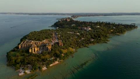 Move over Sirmio Peninsula at Sunset, Sirmione, Lake Garda, Italy - Aerial Drone Move over Sirmio Peninsula at Sunset, Sirmione, Lake Garda, Italy - Aerial Drone