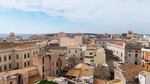 Low over buildings on Isola Di Ortigia, Syracuse, Sicily, Italy - Aerial Drone Low over buildings on Isola Di Ortigia, Syracuse, Sicily, Italy - Aerial Drone
