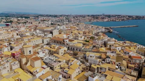 Pan out from Isola Di Ortigia, Syracuse, Sicily, Italy - Aerial Drone Pan out from Isola Di Ortigia, Syracuse, Sicily, Italy - Aerial Drone