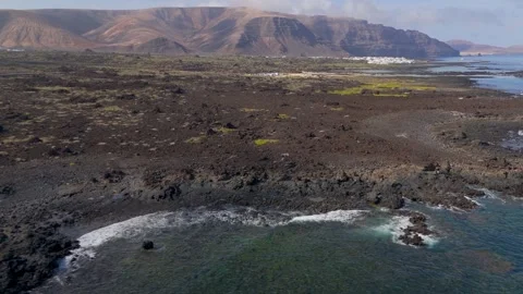 Pan across Caleton Blanco, Charca de la Novia, Lanzarote, Spain - Aerial Drone