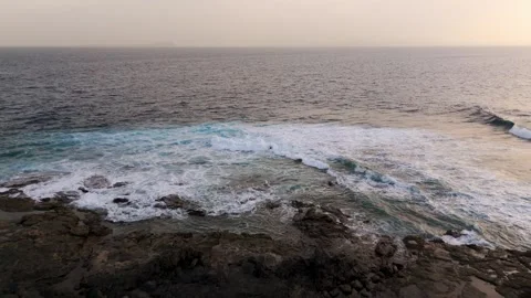 Volcanic coastline at dusk, Lanzarote, Canary Islands, Spain - Aerial Drone