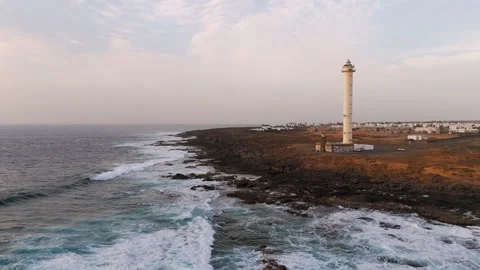 Pan out from Faro de Punta Pechiguera, Lanzarote, Spain - Aerial Drone