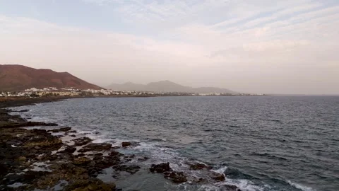 Coastal view Playa Blanca from Punta Pechiguera, Lanzarote, Spain - Aerial Drone