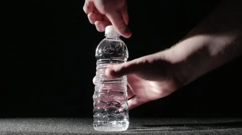 2963 Opening Plastic Water Bottle with Water Splashing Out, 4K Stock Footage 46484349