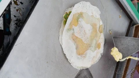 299.Frying Martabak Telor or omelet martabak in hot oil. Savoury pan-fried p Stock Footage 308648499