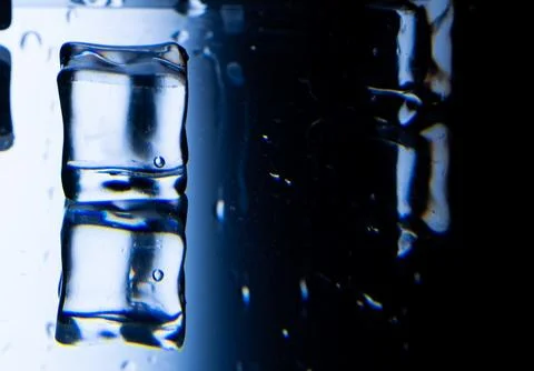2.Abstract Close-up of a Melting Ice Cube on a Reflective Surface Stock Photos