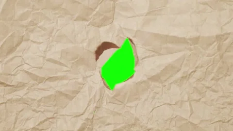 2d old brown paper cutting from center to reveal green screen chroma key Stock Footage 299954585