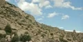 2K 30p Mountain cliff side with clouds passing in time lapse Web Footage