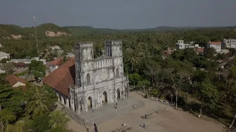2K Aerial close-up view of the ancient catholic Mang Lang Church in Vietnam Stock Footage 97865752