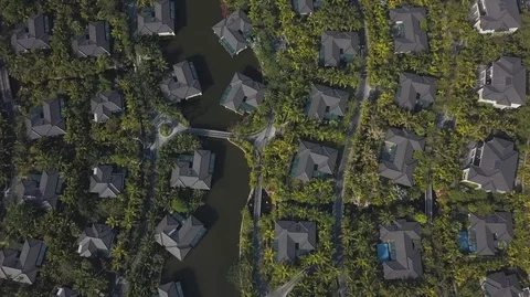 2K Aerial Top Down view of overwater bungalows on the river surrounded with Stock-Footage 128029648