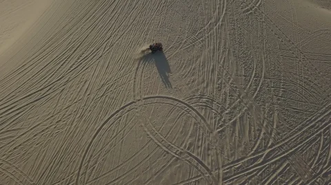2K Aerial top view of Dune ATV with a passenger race across Stock Footage 97857463