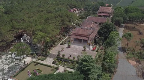 2K Aerial top view of an old asian temple in Bao Loc Vietnam Stock Footage 97861022