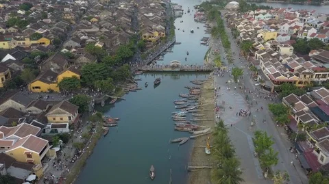 2K Aerial top view of the river and bridge with some boats on water in Hoi An Stock Footage 97883381