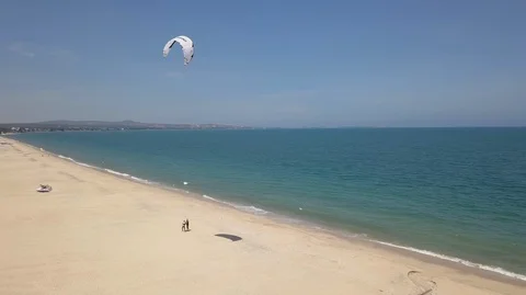 2K Aerial Top View of two people practicing kitesurfing Stock Footage 97859943