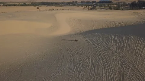 2K Aerial view of Dune buggie with a passenger and ATVs race Stock Footage 97857470