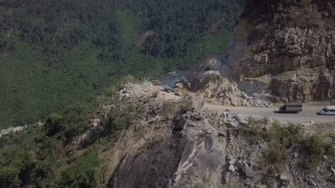 2K Aerial view of the excavator working on the serpentine road Stock Footage 97863339