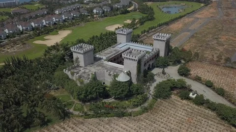 2K Aerial view of RD wine castle on green hill in Mui Ne Stock-Footage 97874315
