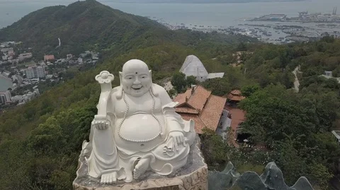 2K Aerial view of sitting Big Happy Buddha in Vietnam Stock Footage 97865872