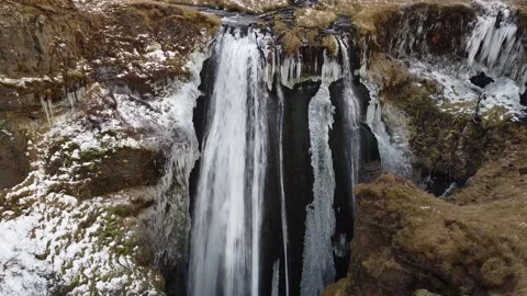 2K Ascending over a beautiful glorious waterfall and its own canyon in Iceland Video stock 145877193