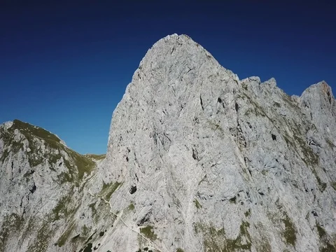 2k Fly towards mountain peak with impressive rock formation Stock Footage 83957598