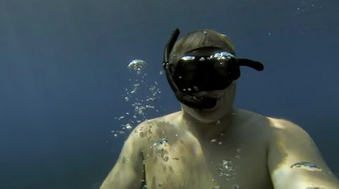 2K : mid, snorkeler surfacing Stock Footage 35650193