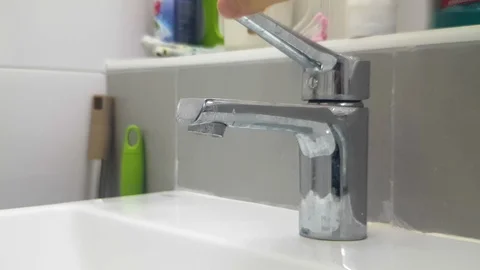 2K Slow motion of hand open and close water faucet in the sink in the restroom Stock Footage 107971888