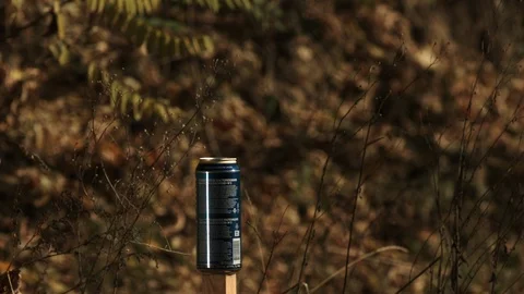 2K Super slow motion. The bullet hits the Bank of beer. Bank of beer explodes. Video stock 92948204
