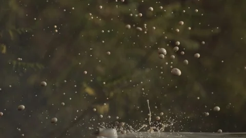 2K Super slow motion. Large drops fall beautifully on the metal table. Video stock 92537767