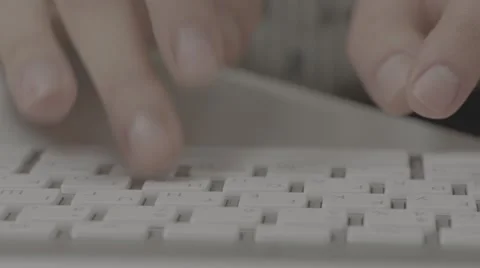 2K Typing on a white apple-keyboard. Sequence Stockbeeldmateriaal 44738409