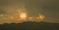 2K Video 1 Majestic thunderhead puffs and dies at sunset in red Web Footage