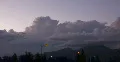 2K Video 30p Thunderhead clouds leave quickly at sunset over the mountains Web Footage