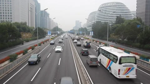 2nd Ring Road near Galaxy SOHO complex building in Beijing, China Stock Footage 336729264