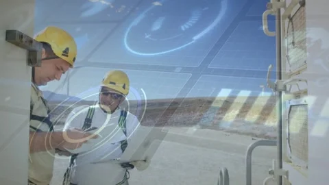 2nd tech arriving, techs comparing laptop and device, verifying solar data with Stock Footage 332704255