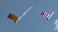 2x Parachutist with big flag HD Footage