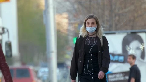 3 in 1. A lot of different people go protective masks. Citi street. Many crowd. Stock Footage 129789596