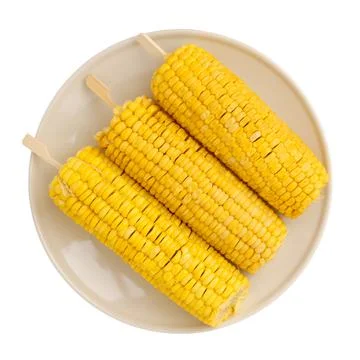 3 boiled corn cobs on a plate isolated on a white background close up Stock Photos