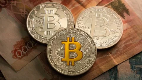 3 Botcoins on the table with russian rubles. Currency. Halving. Cryprto trading Stock Photos
