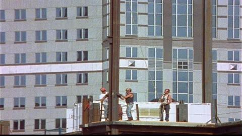 3 Construction Workers attach vertical iron beam timelapse Video stock 145786364