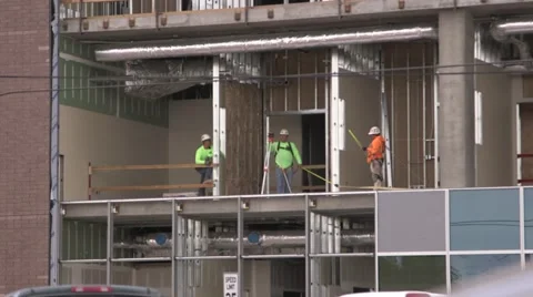 3 constructions workers on an industrial construction site Stock Footage 48827065