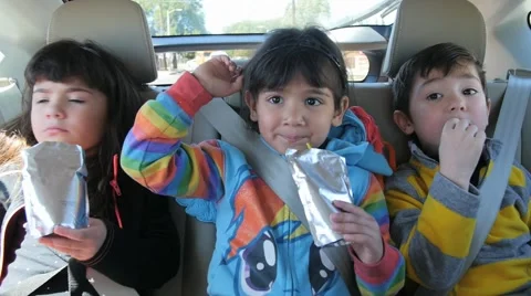 3 CUTE HISPANIC SIBLINGS IN BACK SEAT OF CAR. Stock Footage 63319682
