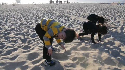 3 CUTE HISPANIC SIBLINGS PLAY IN SAND Stock Footage 63319671