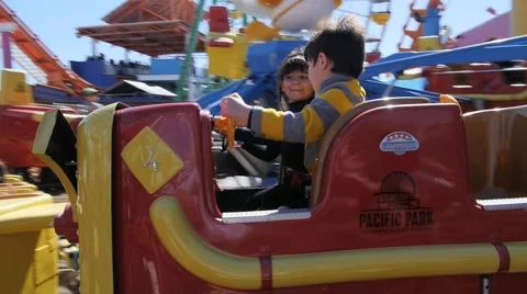 3 CUTE HISPANIC SIBLINGS RIDE AMUSEMENT PARK RIDE. Stock-Footage 63319787