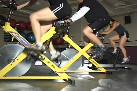 3 CYCLISTS IN SPIN CLASS (stylized) Video stock 128110