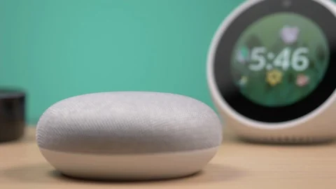 3 Different Smart Home Assistant on a Table Panning Stock Footage 102048729