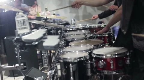 3 drummers playing drum set at the party. Powerful. Enthusiastically. 2 shots on Stock Footage 46304294